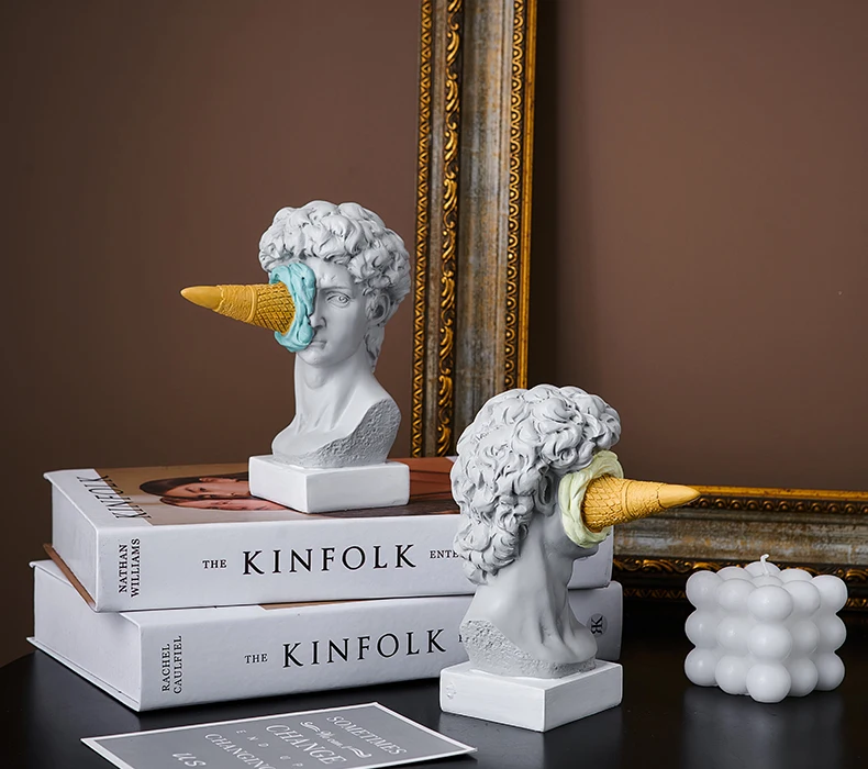 Step into a world where classical sculpture and playful design converge with our Ice Cream Smashed Face Statues of David, set amidst elegant home accents