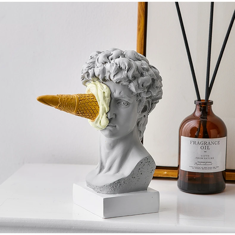 Solo Ice Cream Smashed Face Statue of David with vanilla cone, juxtaposed with elegant home fragrance, embodying a blend of timeless art and contemporary fun.